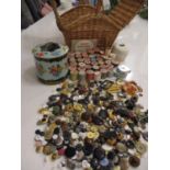 A sewing basket and contents to include wooden cotton reels such as Silko and Barbours, together