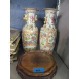 A pair of late 19th century Chinese Cantonese vases, together with a vase stand