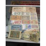 A collection of WWII period and late British and foreign bank notes to include British and