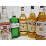 A mixed lot to include two bottles of 1825 Bells blended Scotch Whisky 1l, a litre bottle of