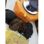 A Joan Biggs formal hat, an Amber of Amersham hat box, fur hats, a scarf and evening bags