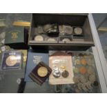 A cash tin containing various commemorative and other coins to include boxed Festival of Britain