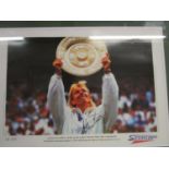 A limited edition autographed picture of Martina Navratilova holding the Ladies Winners Plate in