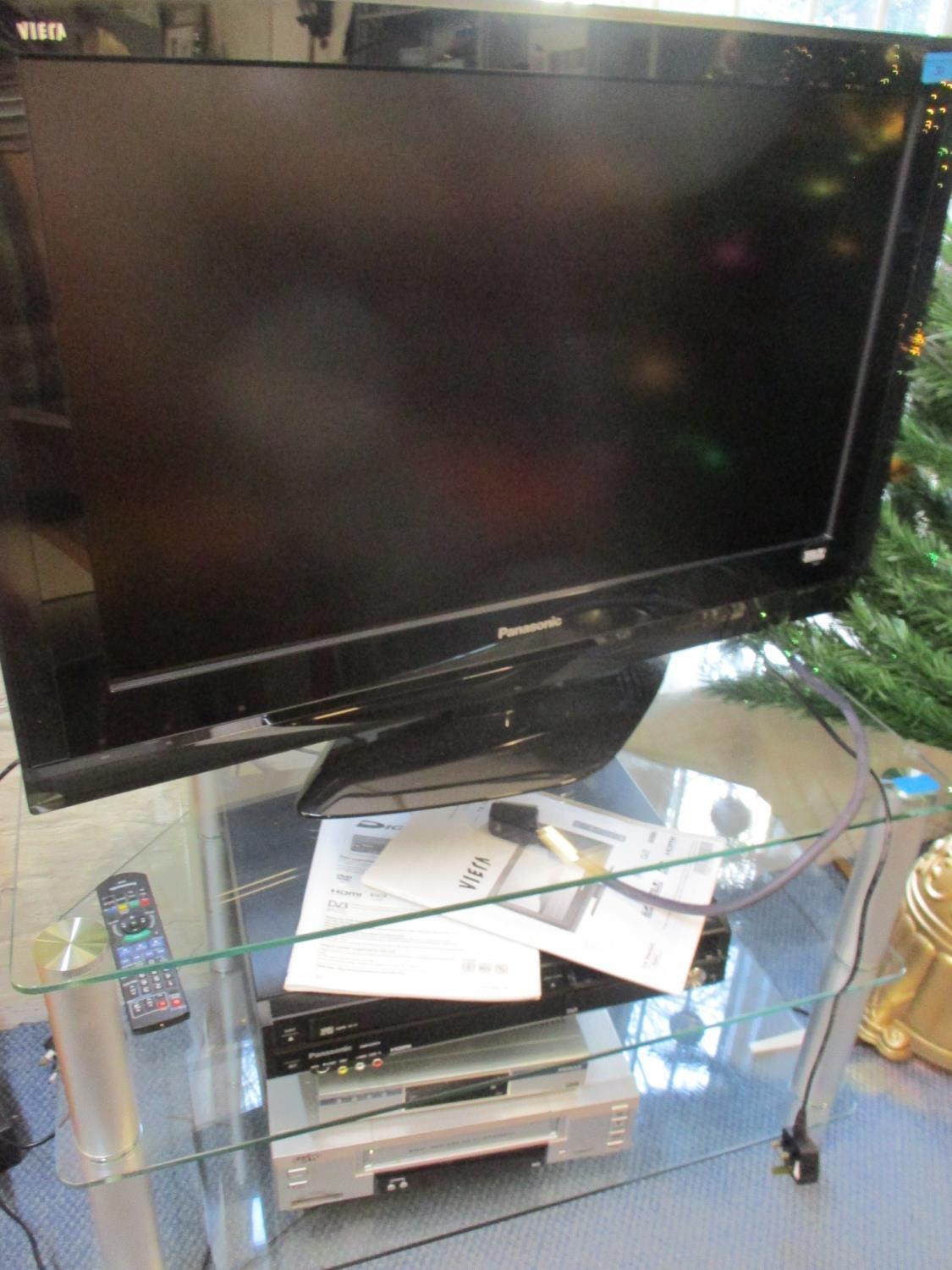A Panasonic Viera flatscreen television, VHS cassette player and a Sanyo combination unit with