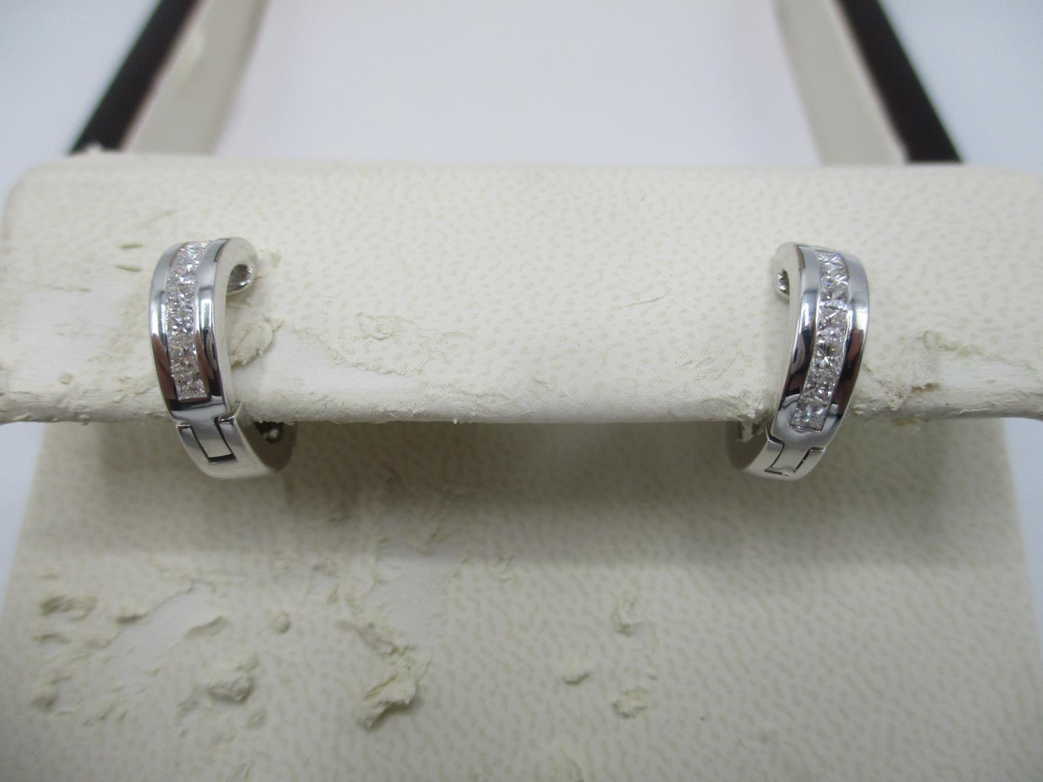 A pair of Tiron 18ct white gold earring set with approximately 0.40ct diamond, total