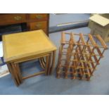 A nesting set of three G-Plan teak occasional tables and a mango wood twenty bottle wine rack