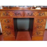 A reproduction mahogany twin pedestal desk, two long drawers above short drawers, 31" x 42" x 20"