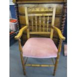 An early 20th century spindle back armchair
