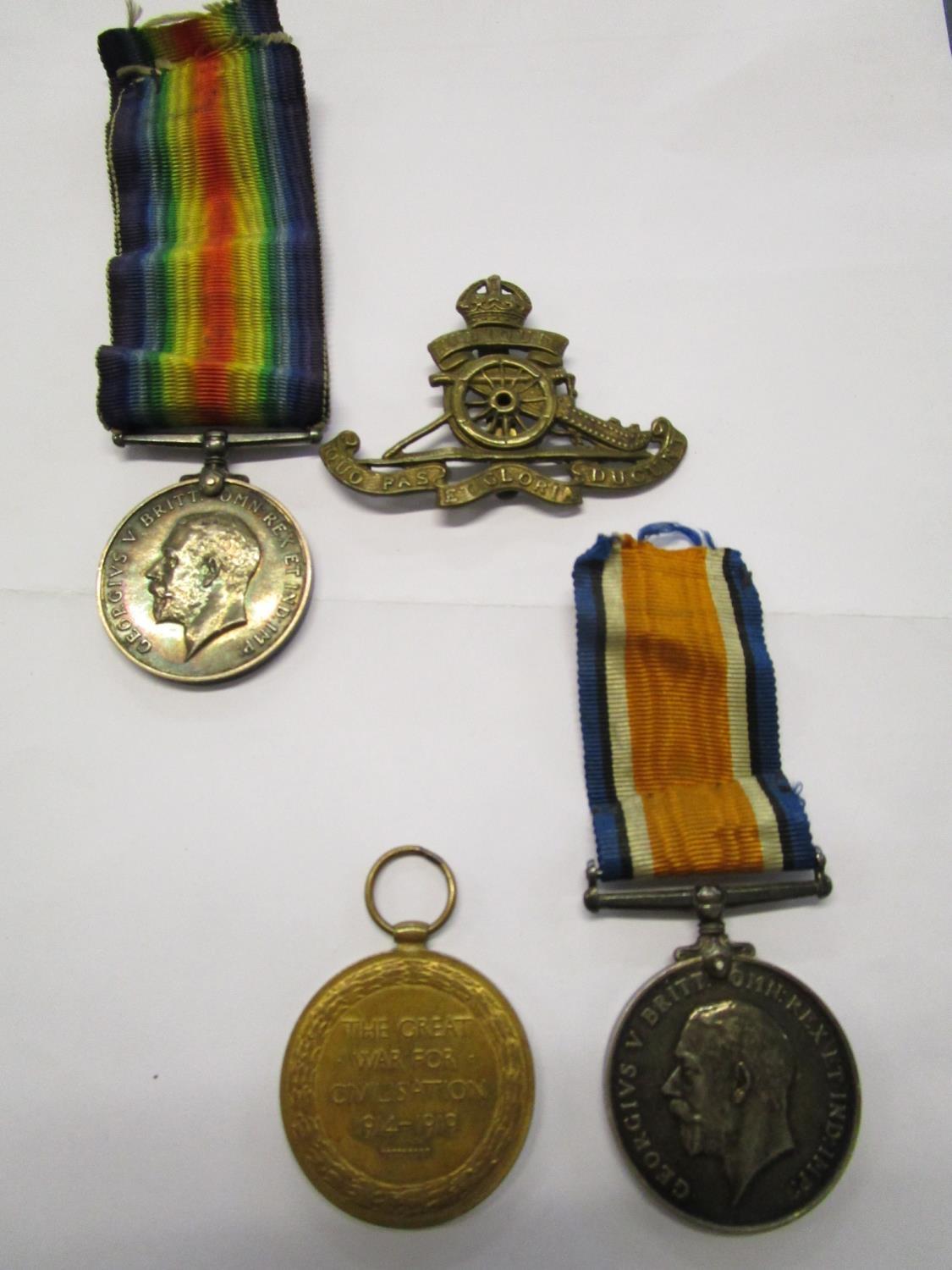 WW1 BWM and ribbon named to 2110 J S Freeman RE with associated brass cap badge and WW1 BWM and