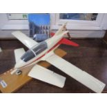 An Exmo BD-5B American microplane display model on a wooden mount having two pairs of
