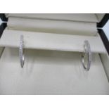 A pair of Tivon 18ct white gold earrings set with diamonds 0.16ct