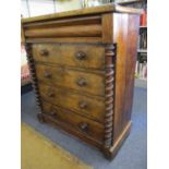A late 19th century Scottish walnut chest of four drawers below a cushioned drawer flanked by barley