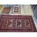 A Persian carpet, a scatter rug and two prayer mats