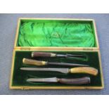 A Joseph Rodgers & Sons horn handled carving set in presentation box