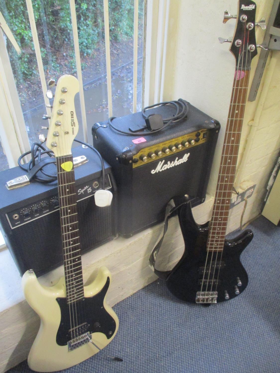 A Marshall amp together with a Squier 15amp, Ibanex bass guitar and a Yamaha SE110 guitar