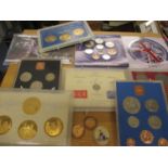 A small collection of mainly decimal coinage in display boxes to include 1980 Queen Mother gold