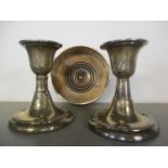 A pair of silver dwarf candlesticks, and a silver and treen wine coaster, total weight 487.2g