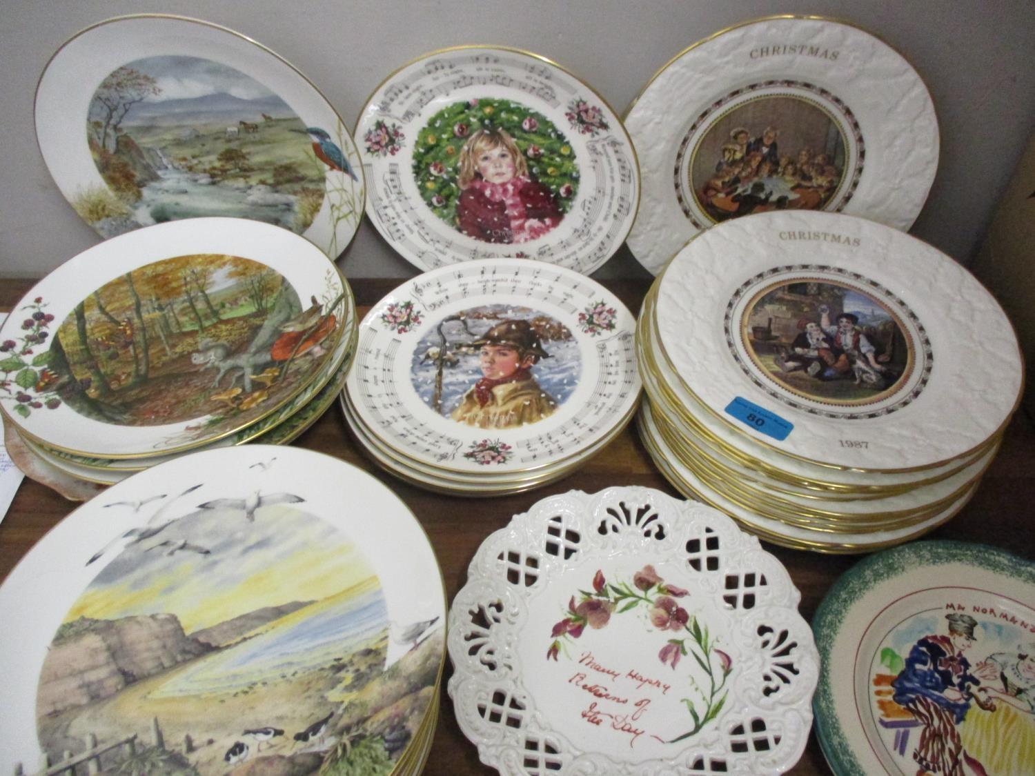 A quantity of twenty nine mixed pictorial and Christmas plates by Royal Worcester and other