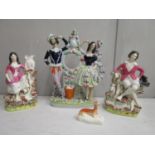 Victorian Staffordshire pottery to include a clock case figural group, a pair of Staffordshire