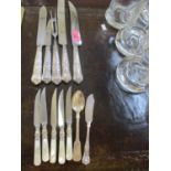 A small quantity of silver handled cutlery and a silver teaspoon, total weight 500g