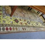 A Turkish yellow ground rug with geometrical design RAF