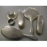 An early 20th century silver machine turned dressing table set, together with a napkin ring and an