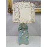 A 1950s American gold and green ceramic irregular shaped table lamp with a fibre glass shade, pat