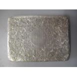 A Victorian silver card case having all over scroll decoration with inscription