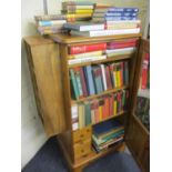 A Ducal cabinet with glazed door having an attached side storage unit, together with mixed books