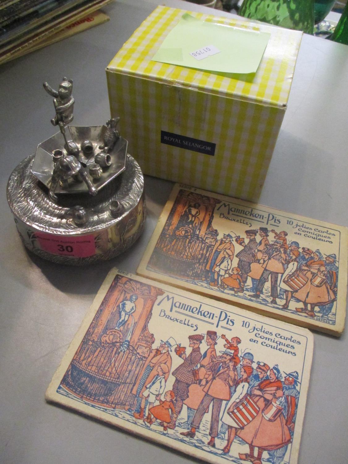 A boxed Royal Selanger Disney musical ornament, together with two Momeken-pig postcards