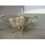 A silver twin handled sugar bowl on four feet, weight 175.8g