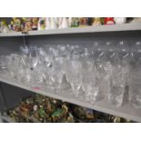 A quantity of mixed glassware to include modern wine glasses and etched water tumblers engraved '