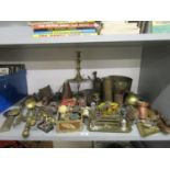 A mixed lot of brassware and other items to include garden pumps, candlesticks