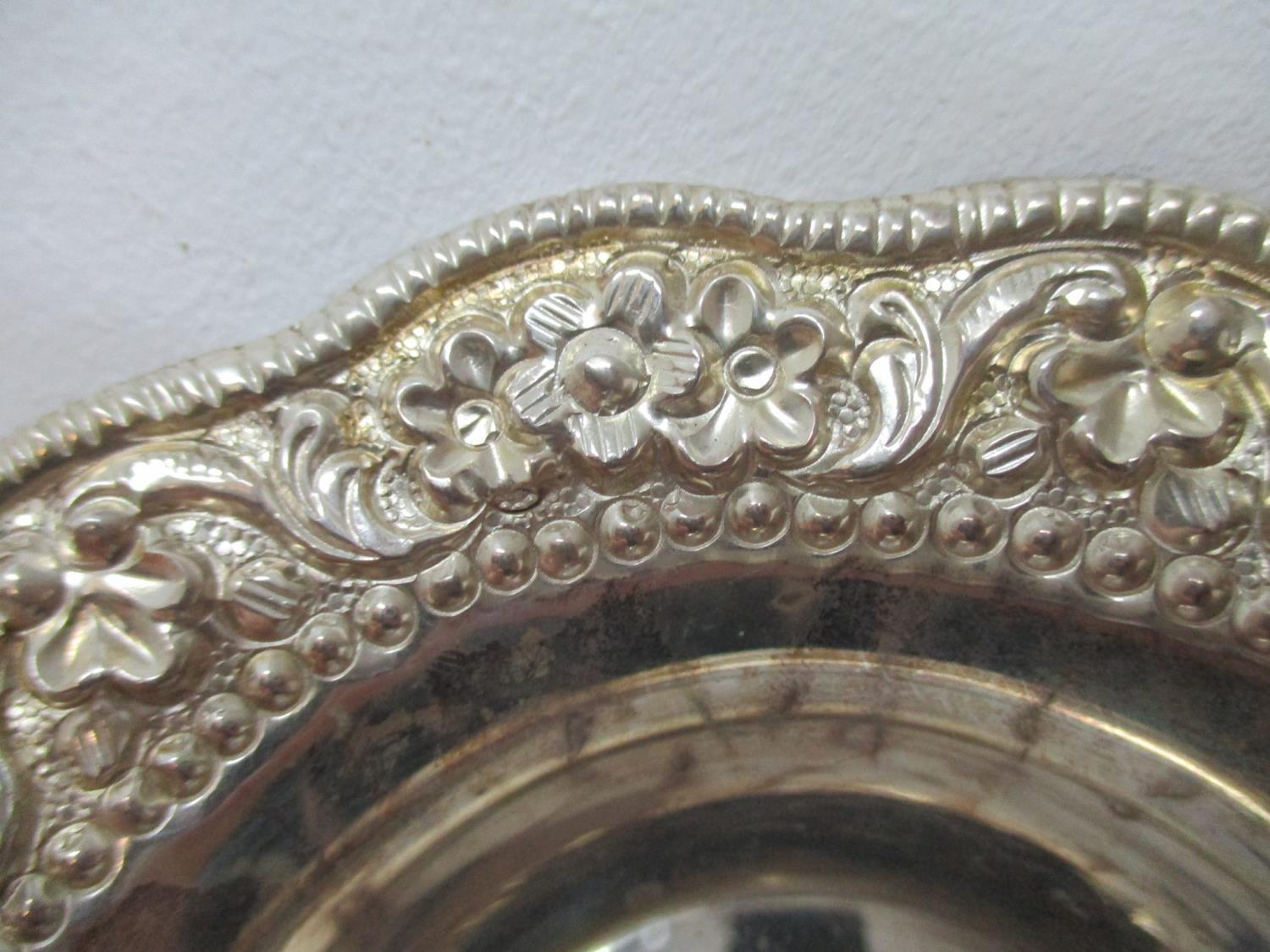 A set of six silver coloured metal dishes, each with a floral and leaf embossed and chased, shaped - Image 4 of 6