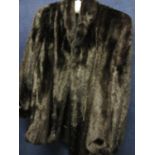 A vintage black mint jacket with cuff sleeves, 28" long x 42/44"chest approximately