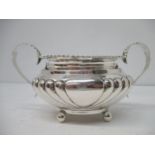 A Victorian silver sugar bowl by John Henry Rawlings, London 1898, with twin loop leaf handles and