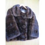 A vintage Edward Weiss musquash fur box jacket having two fur buttons and deep collar, 40" chest x