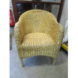 A John Lewis wicker armchair Location SL