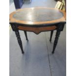 A Victorian ebonized sewing table