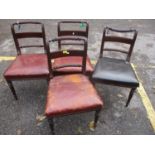 A set of four Regency rope-twist bar back dining chairs