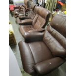 A leather reclining armchair and companion