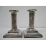 A pair of Victorian silver candlesticks by Hawksworth, Eyre & Co Ltd Sheffield 1880 4 7/8"h with a