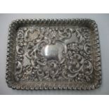 A Victorian silver dressing table tray by Matthew John Jessop, Birmingham 1898, embossed and