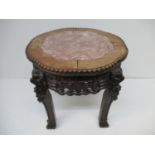 A late 19th century Chinese padouk table/ stand with a lobed marble top, a beaded edge and carved