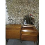 A mid 20th century oak chest of four drawers and a matching three drawer dressing table