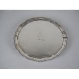 A George III silver circular Waiter engraved crest, gadroon rim on hoof feet, London 1773, 7in,