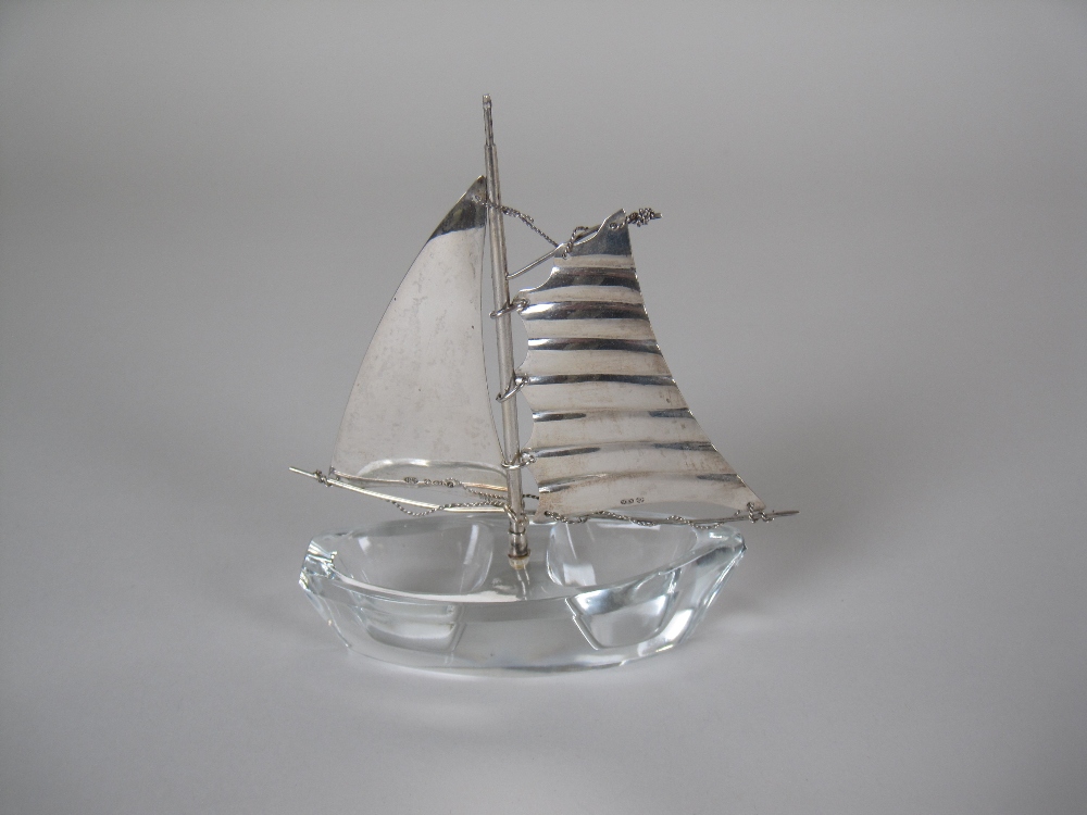 A double glass Salt in the form of a Yacht with continental silver sails