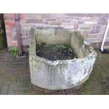 A very large stone Trough with one rounded end, 3ft 11in x 2ft 10in, cracked