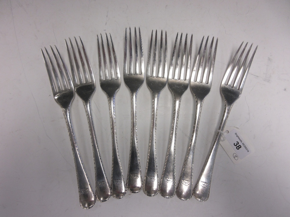 Eight George IV silver Dinner Forks, old english pattern with feather edges and engraved initials,