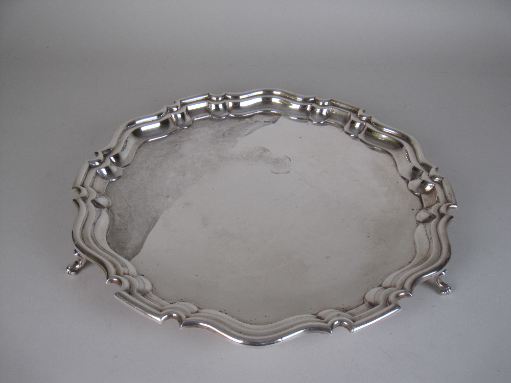 A George V silver shaped circular Salver on three scroll feet, Sheffield 1925, 13 1/2in D